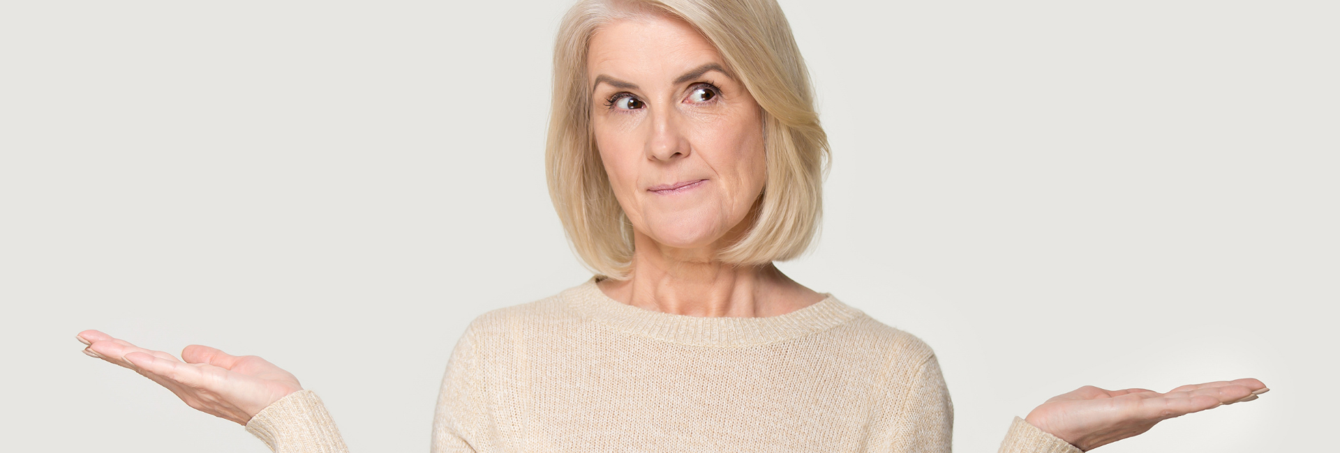 woman deciding between eyelid surgery or brow lift in DC